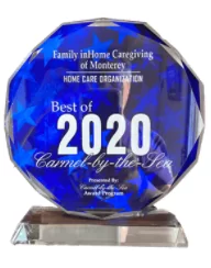 A blue award with the words " family in home caregiving of monterey " on it.