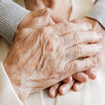 caregive hugging elderly client - Monterey In Home Dementia Care